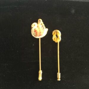 Set of two stick pin brooches one cloisonné swan and one gold love knot style